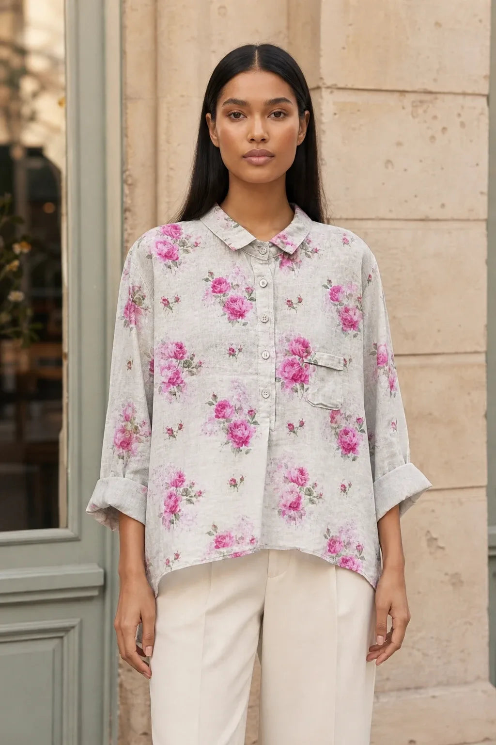 Floral print blouse in an eighth colorway on a model in a contrapposto stance