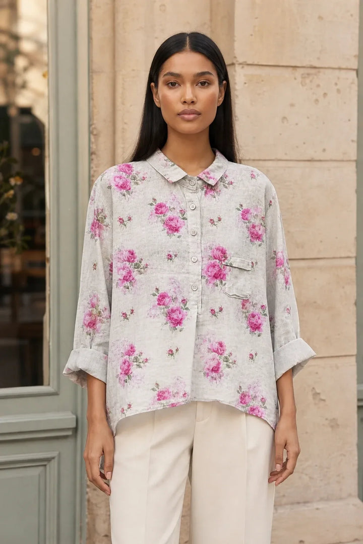 Floral print blouse in an eighth colorway on a model in a contrapposto stance