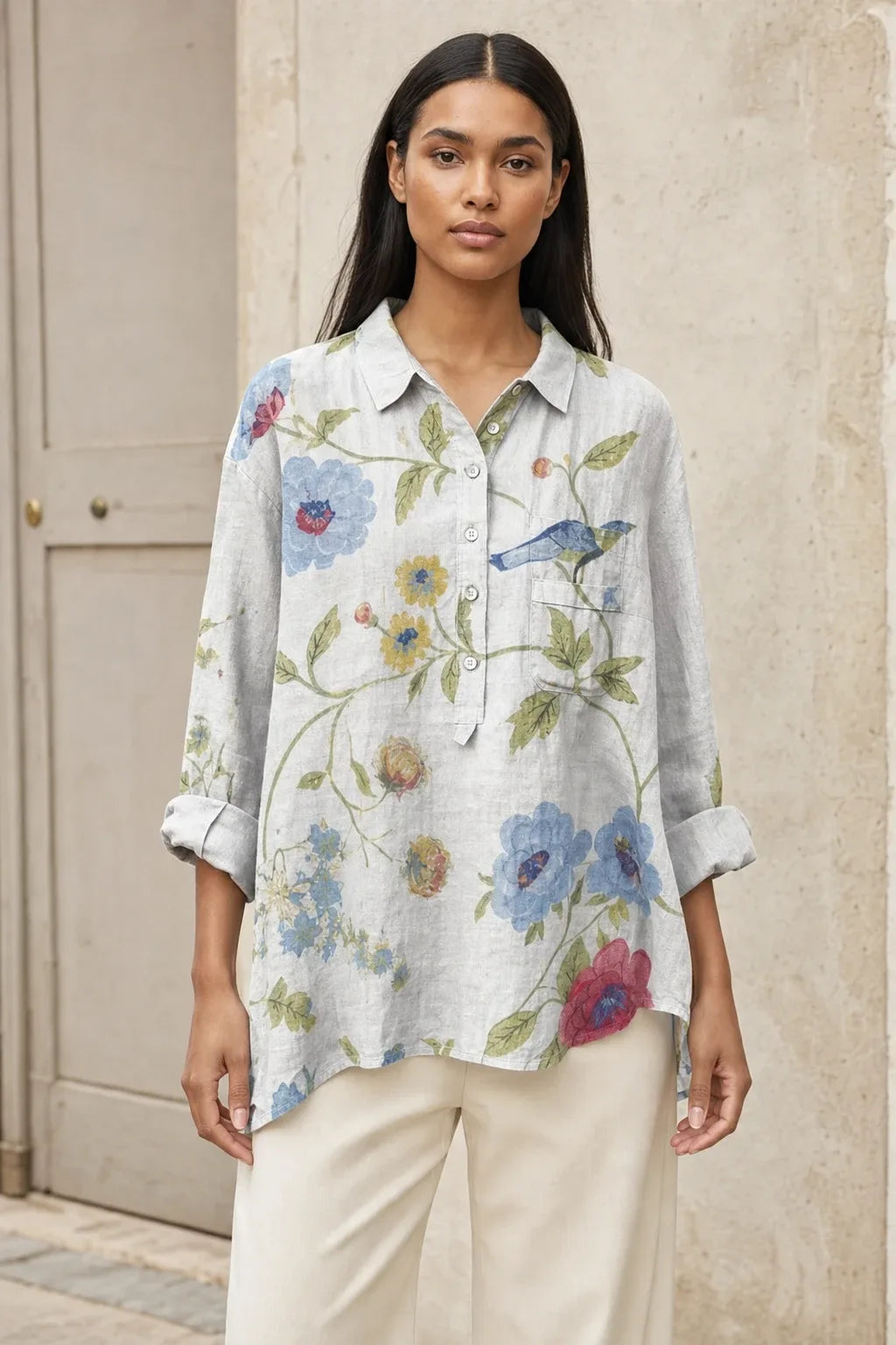 Floral print blouse in a ninth colorway on a model in a contrapposto stance