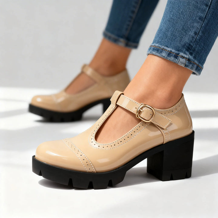 Beige T-bar brogue Mary Jane shoe, full view of style and silhouette