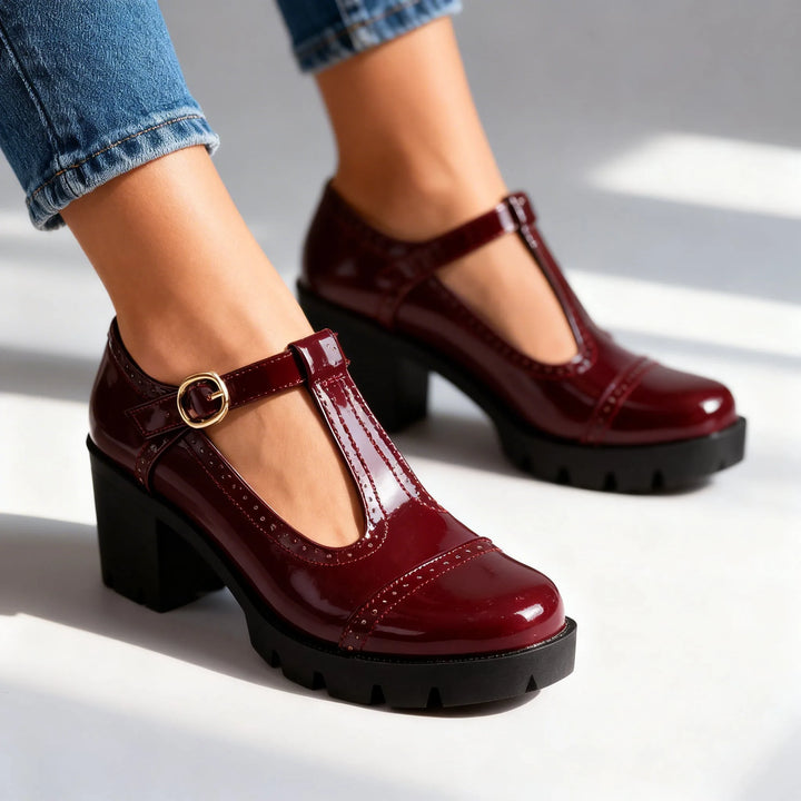 Burgundy T-bar brogue Mary Jane shoe, front view showing toe cap and perforated detailing