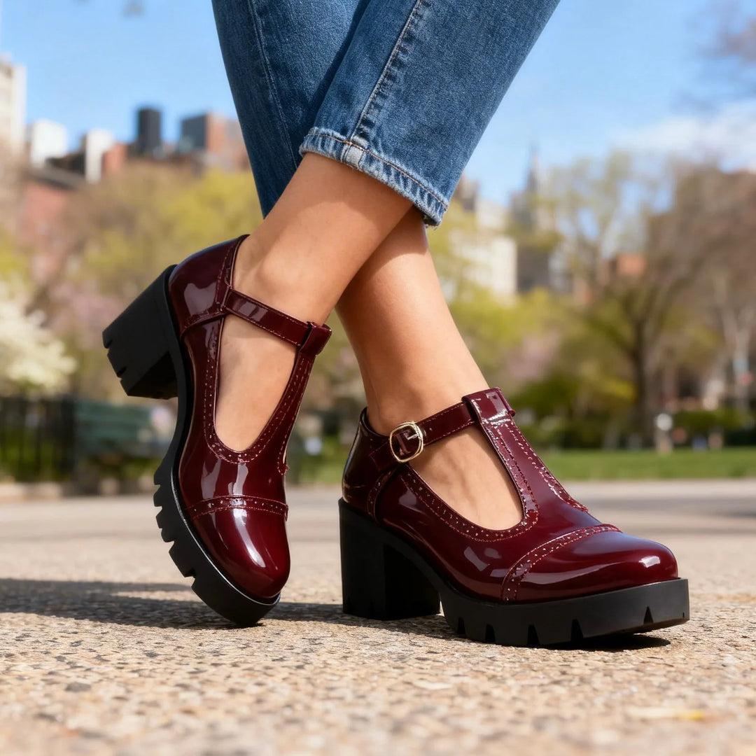 Burgundy T-bar brogue Mary Jane shoe, side profile highlighting strap and block heel
