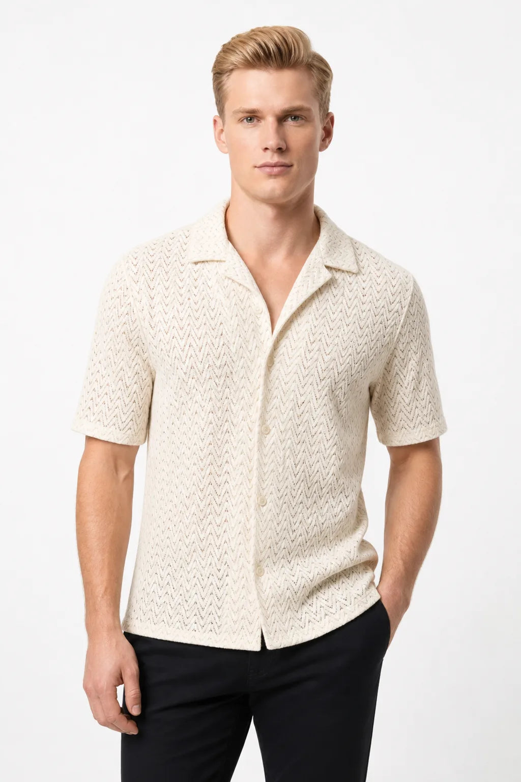 Beige chevron knit camp shirt on model in contrapposto stance