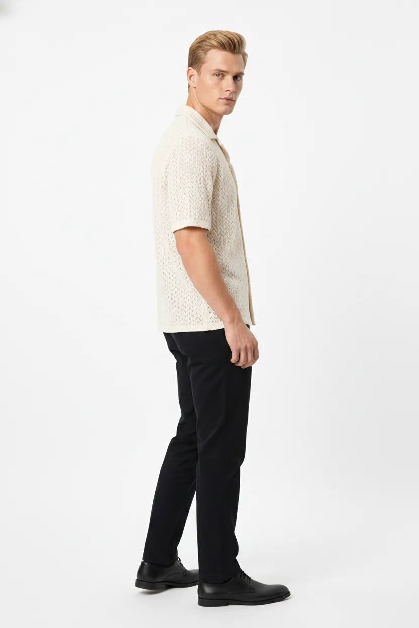 Beige chevron knit camp shirt on model in three-quarter turn