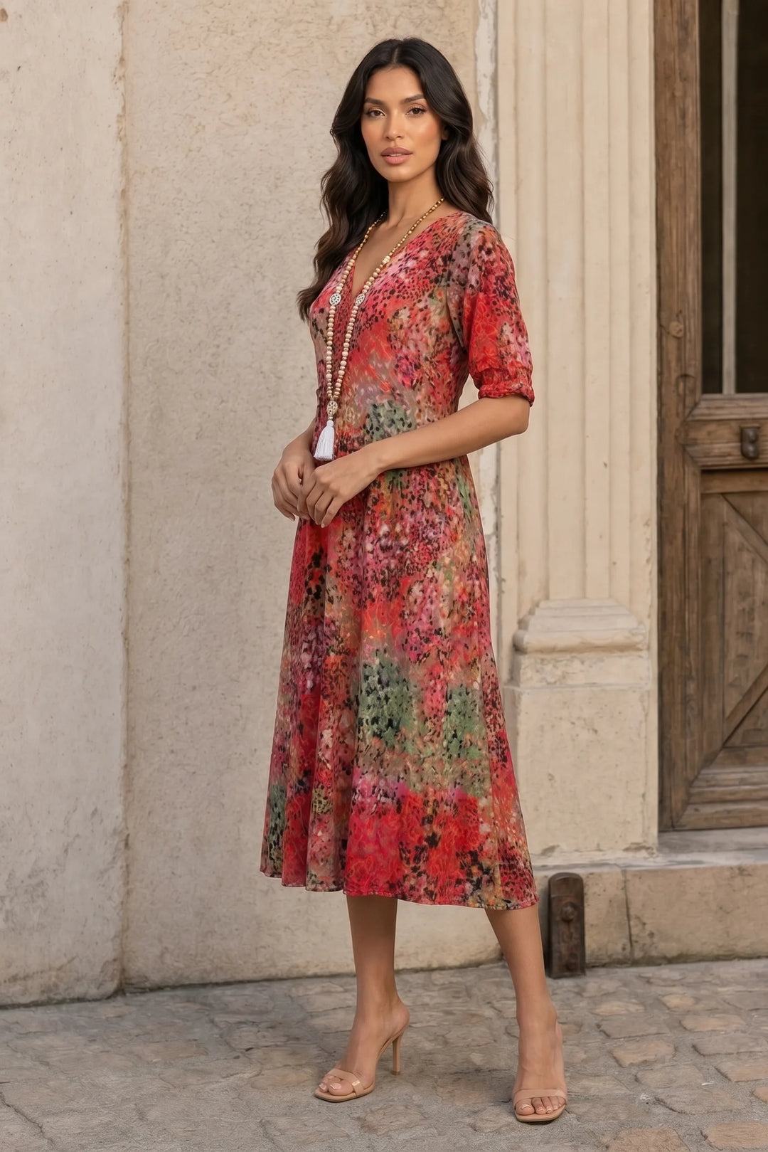 Red floral boho midi dress on a model in a three-quarter turn