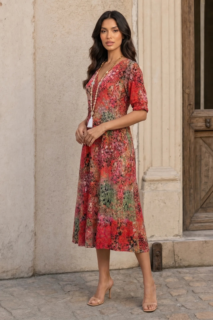 Red floral boho midi dress on a model in a three-quarter turn