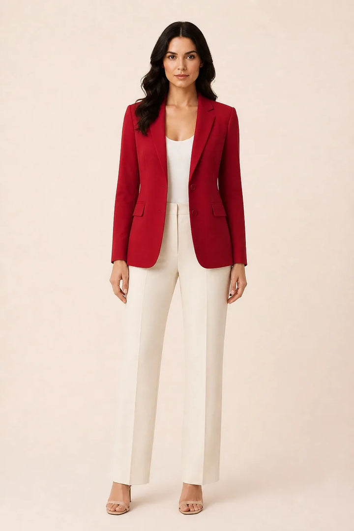 Red open-front blazer with notch lapels worn by a model in a contrapposto stance