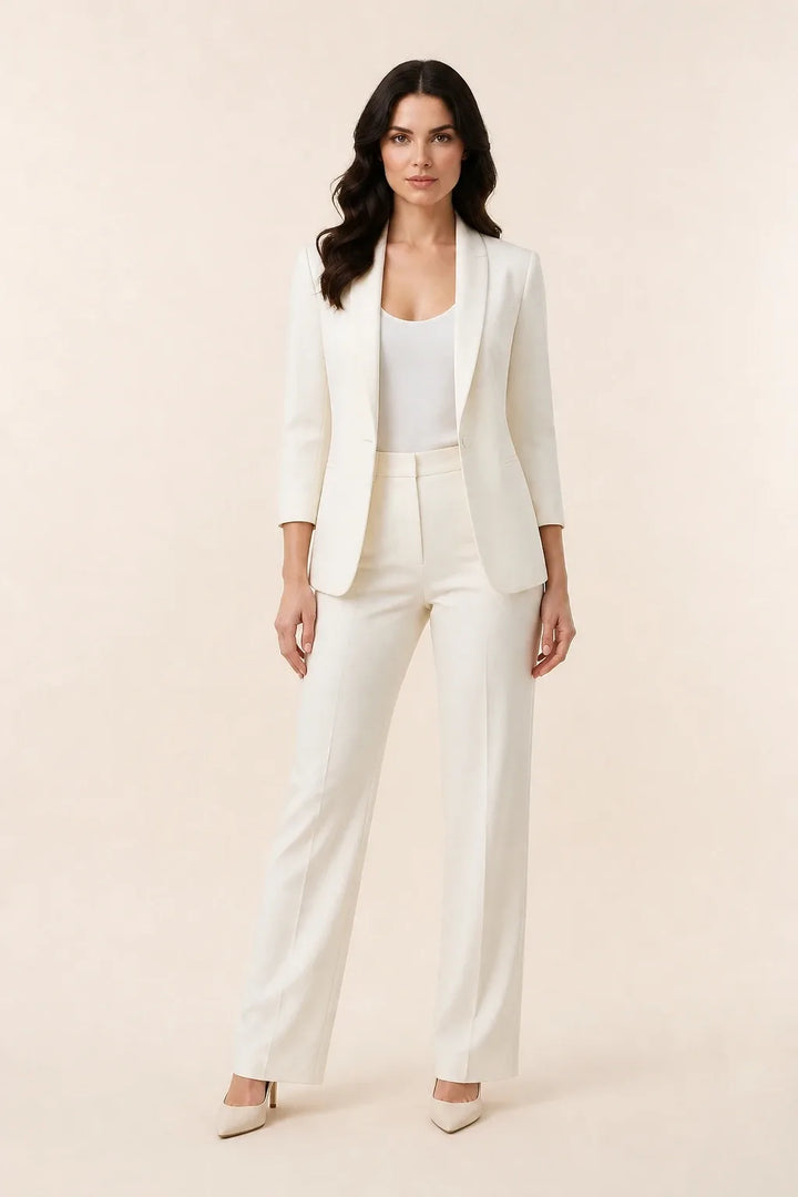 White open-front blazer with notch lapels worn by a model in a contrapposto stance