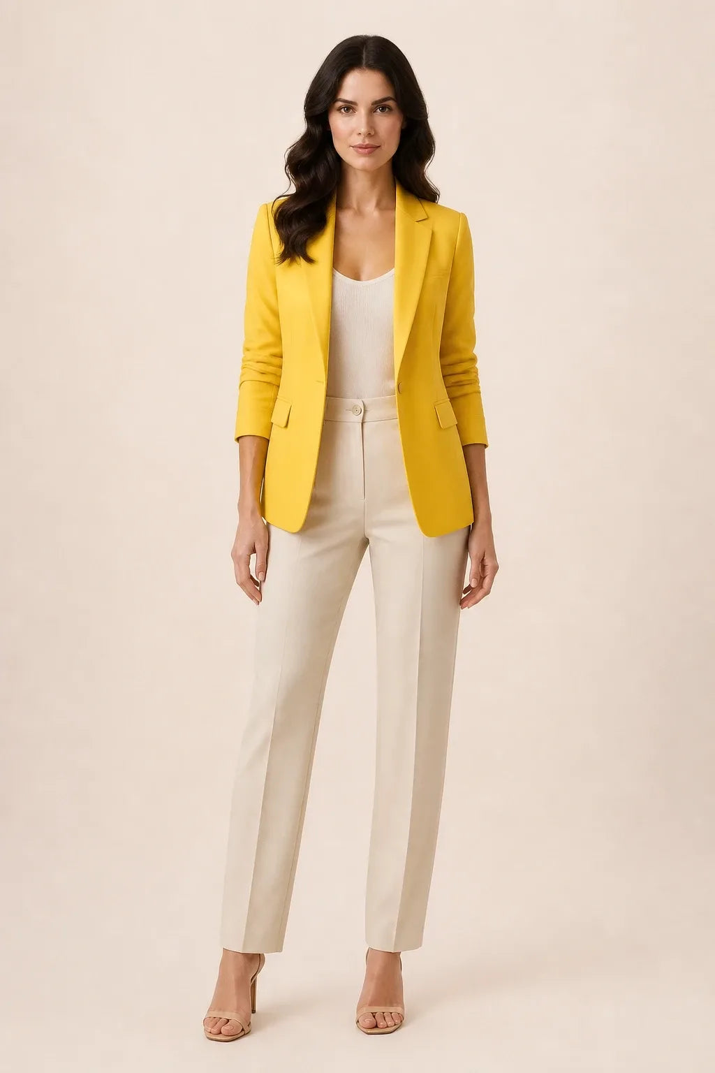 Yellow open-front blazer with notch lapels worn by a model in a contrapposto stance