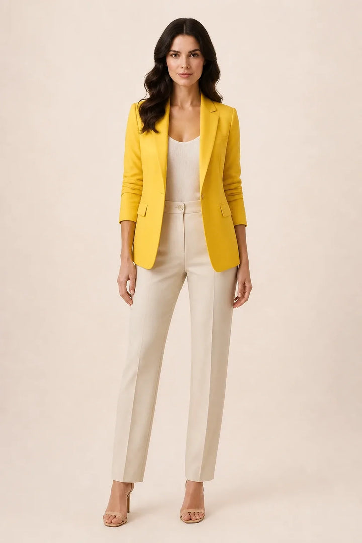Yellow open-front blazer with notch lapels worn by a model in a contrapposto stance