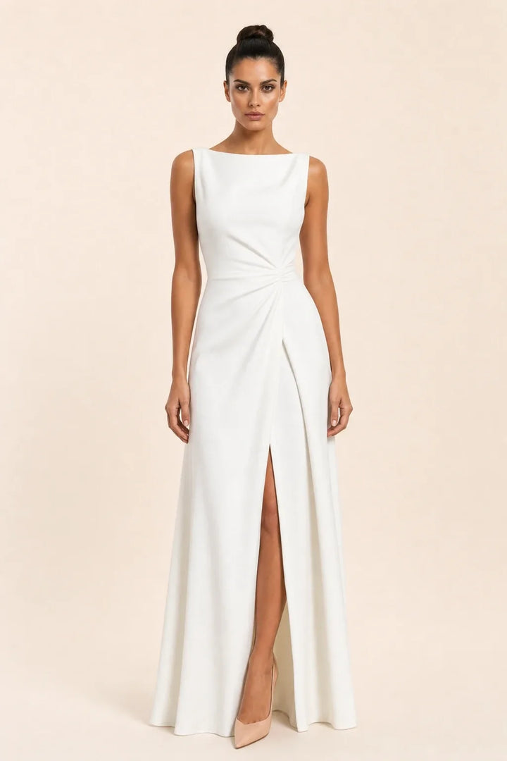 White ruched sleeveless gown with thigh-high slit, model in contrapposto stance