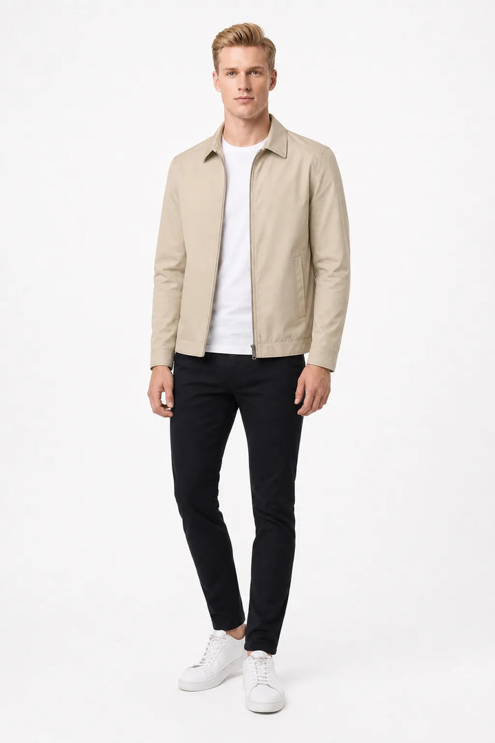 Beige gingham-lined harrington jacket on a standing model in contrapposto stance