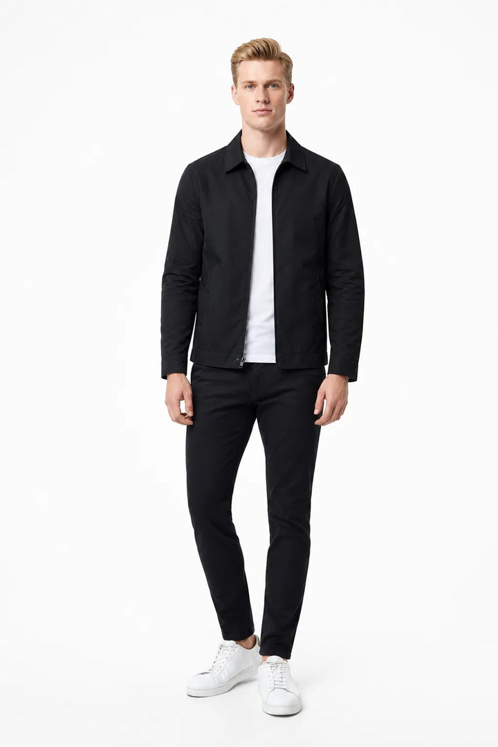 Black gingham-lined harrington jacket on a standing model in contrapposto stance