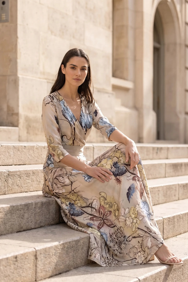 Model wearing floral wrap maxi dress in second outdoor lifestyle setting