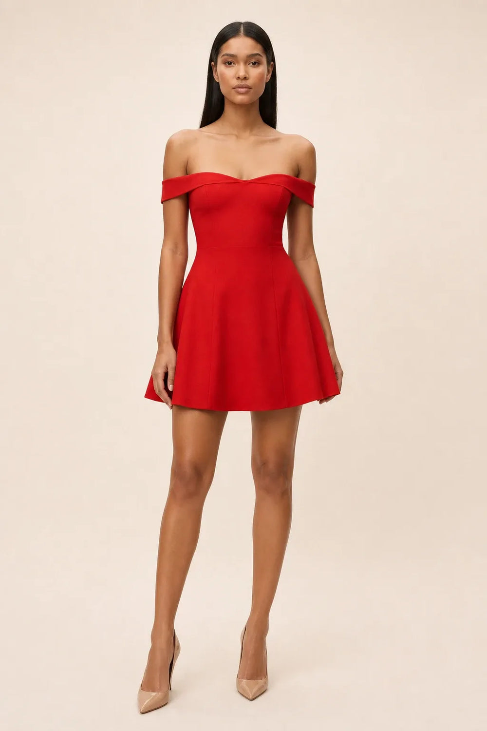 Red off-shoulder skater mini dress on model in contrapposto stance