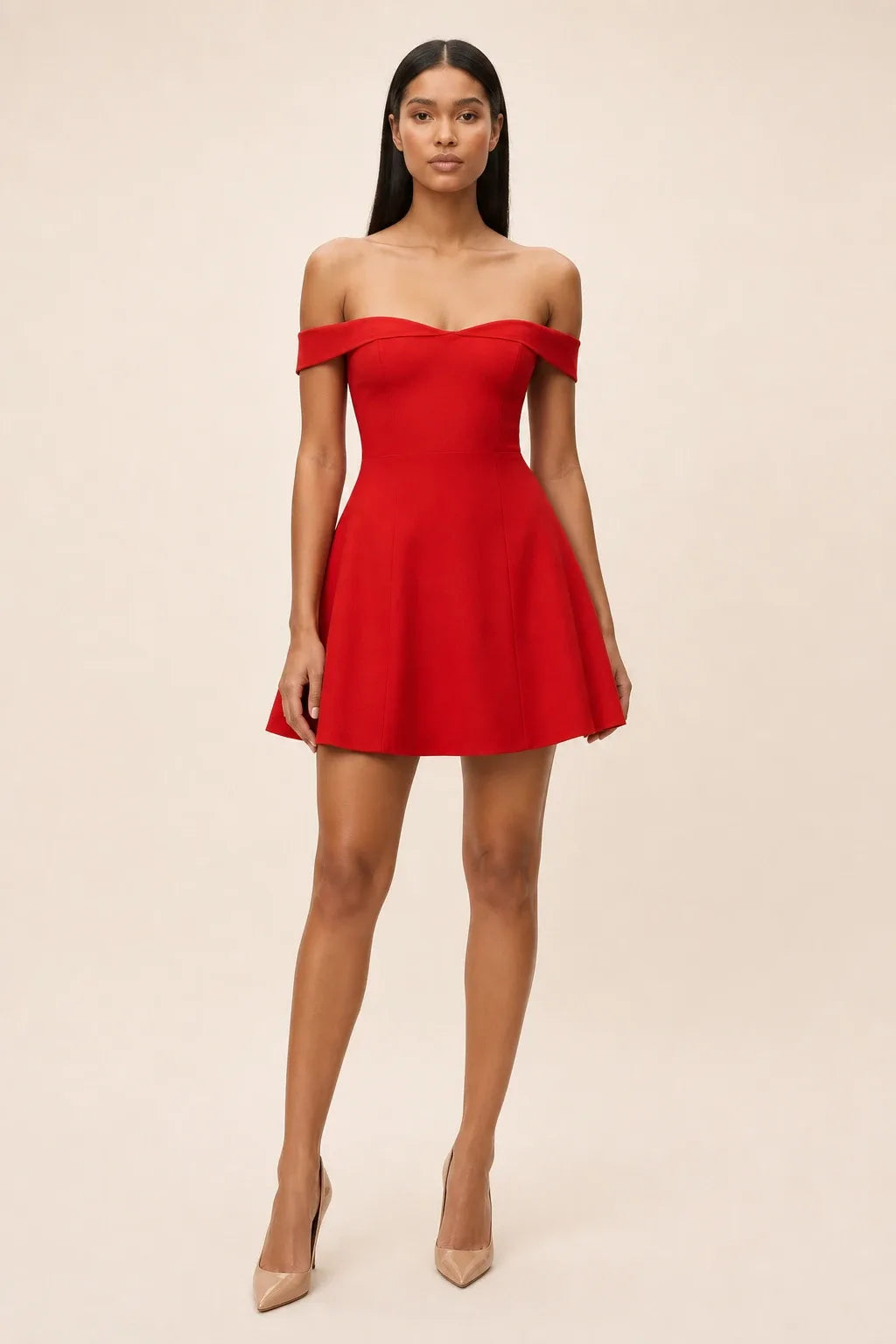 Red off-shoulder skater mini dress on model in contrapposto stance