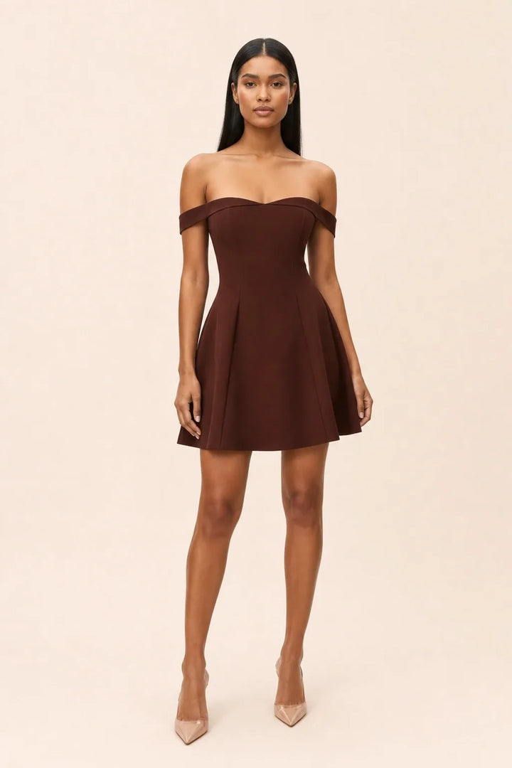 Wine red off-shoulder skater mini dress on model in contrapposto stance