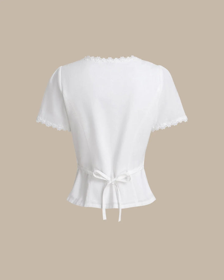 White lace trim button blouse, model in alternative standing pose