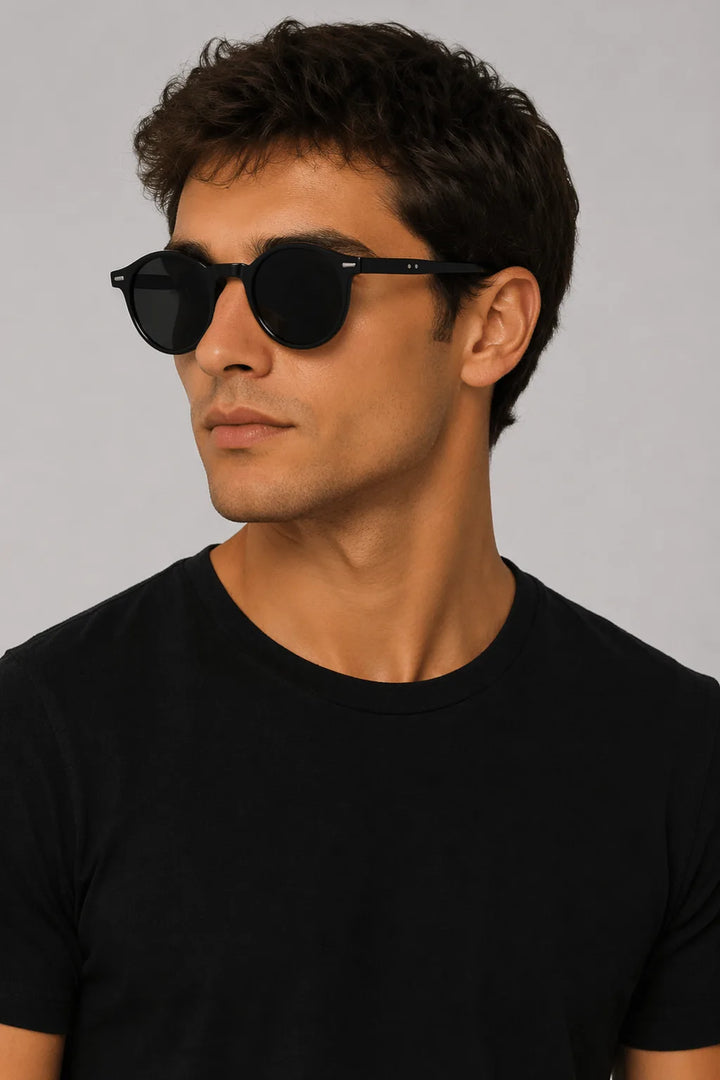 Round bright black acetate retro sunglasses shown from the front