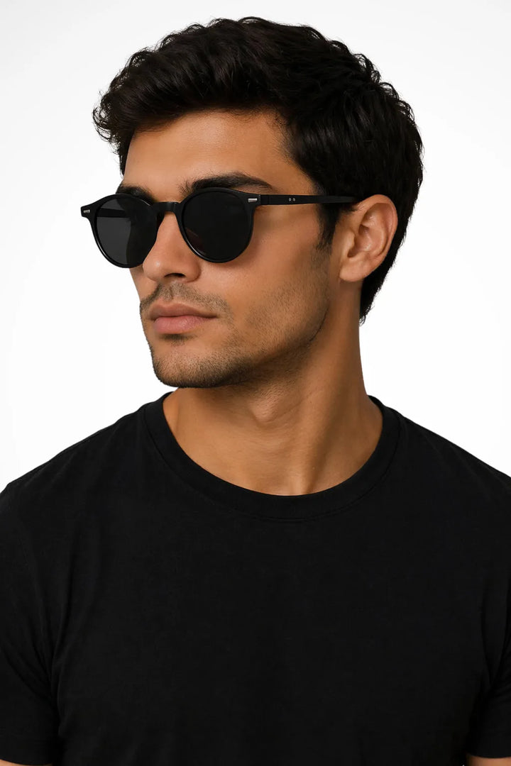 Round sand black acetate retro sunglasses shown from the front