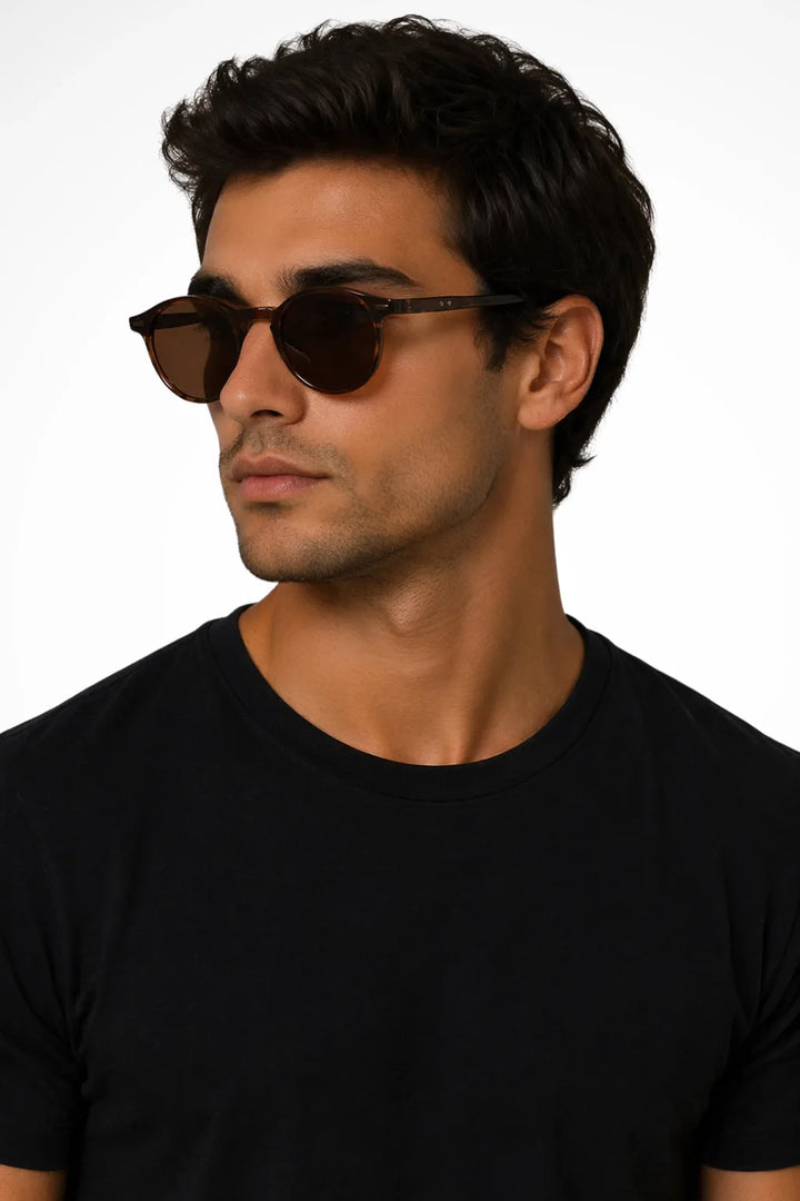 Round tea-toned acetate retro sunglasses shown from the front
