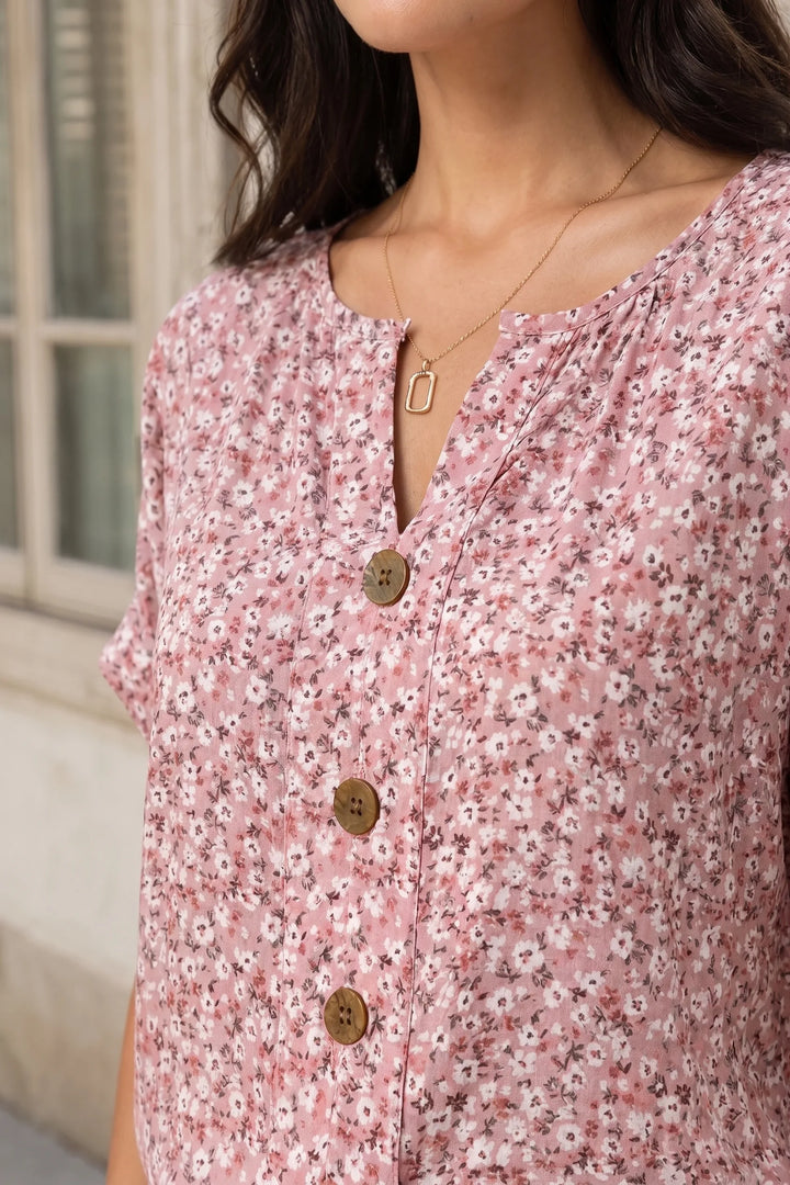 Close-up detail of a ditsy floral button blouse