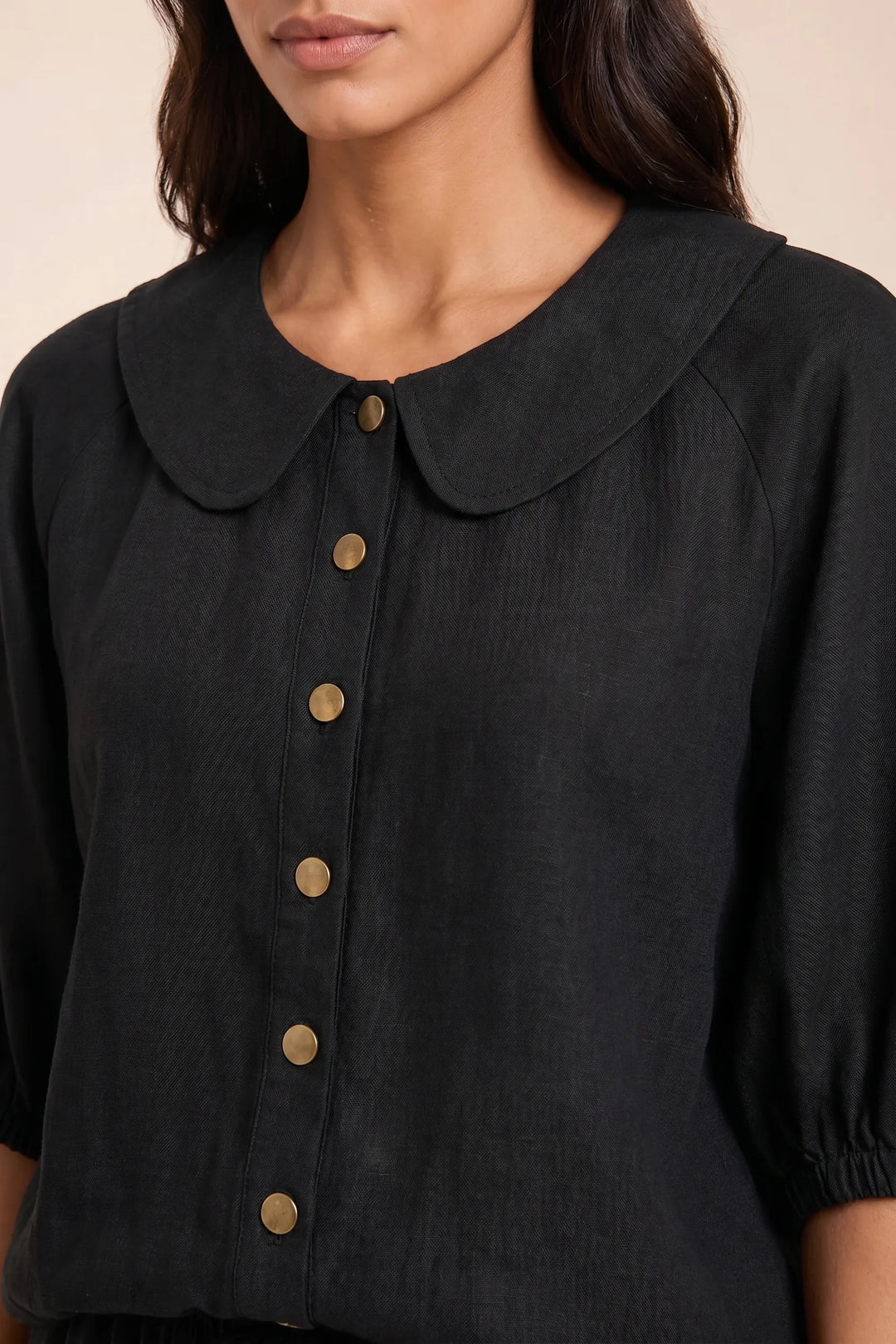 Close-up detail of black peter pan collar on coordinating two-piece set