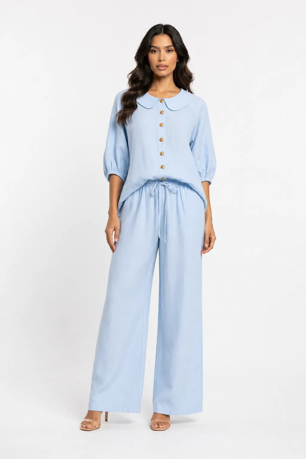 Blue peter pan collar matching set on model in contrapposto stance