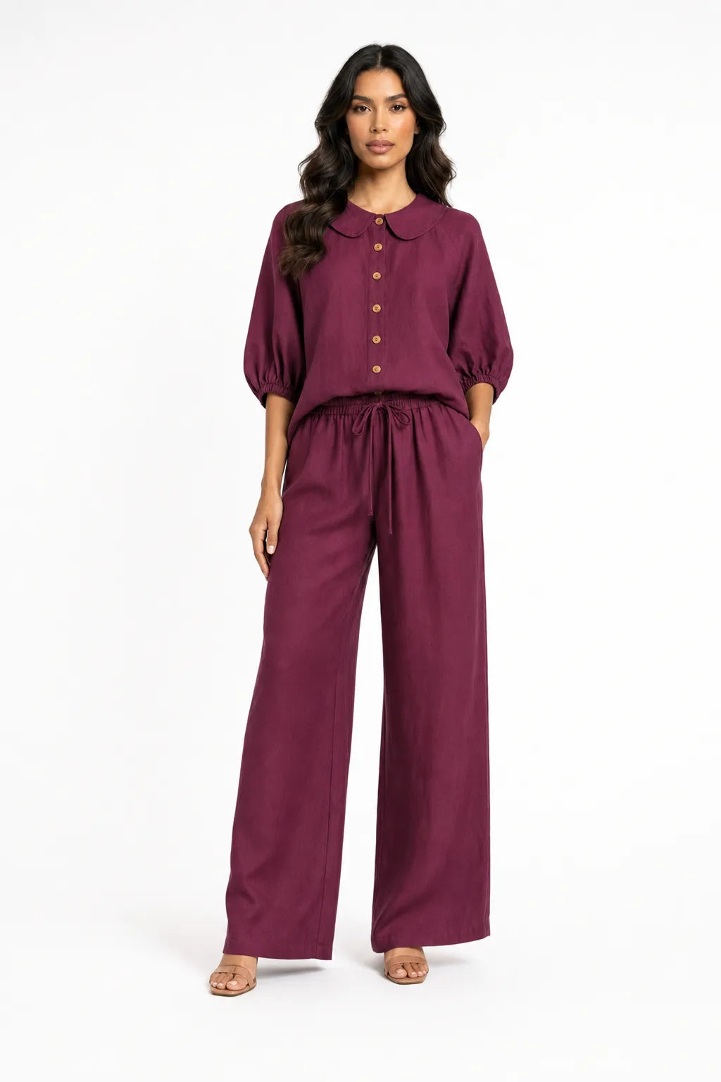 Burgundy peter pan collar matching set on model in contrapposto stance