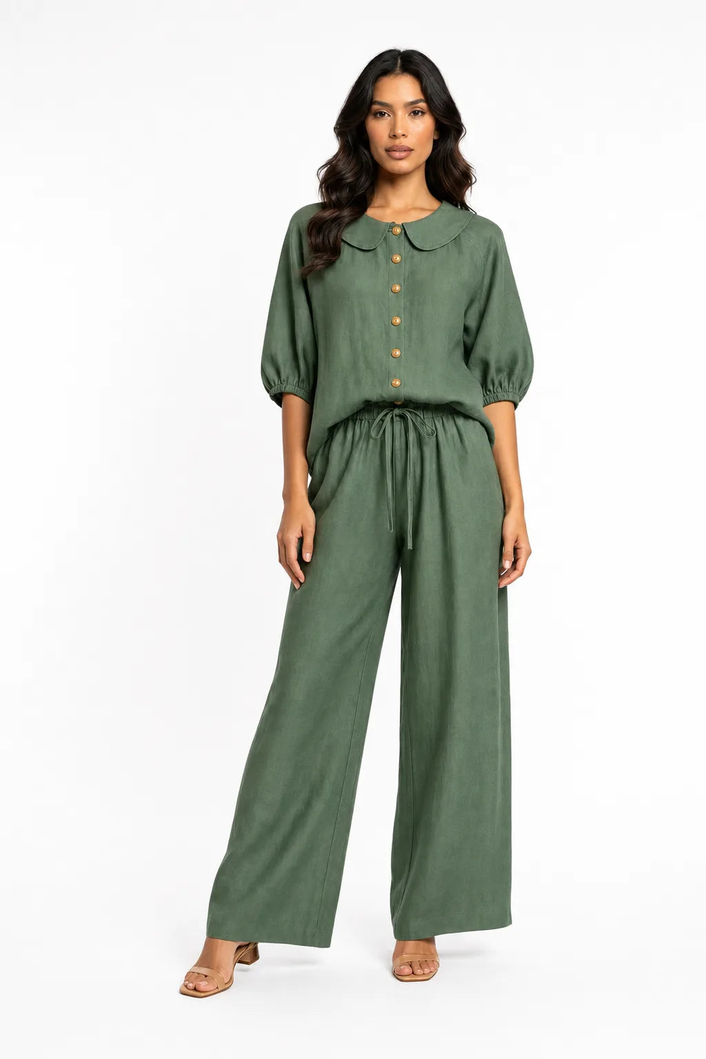 Green peter pan collar matching set on model in contrapposto stance