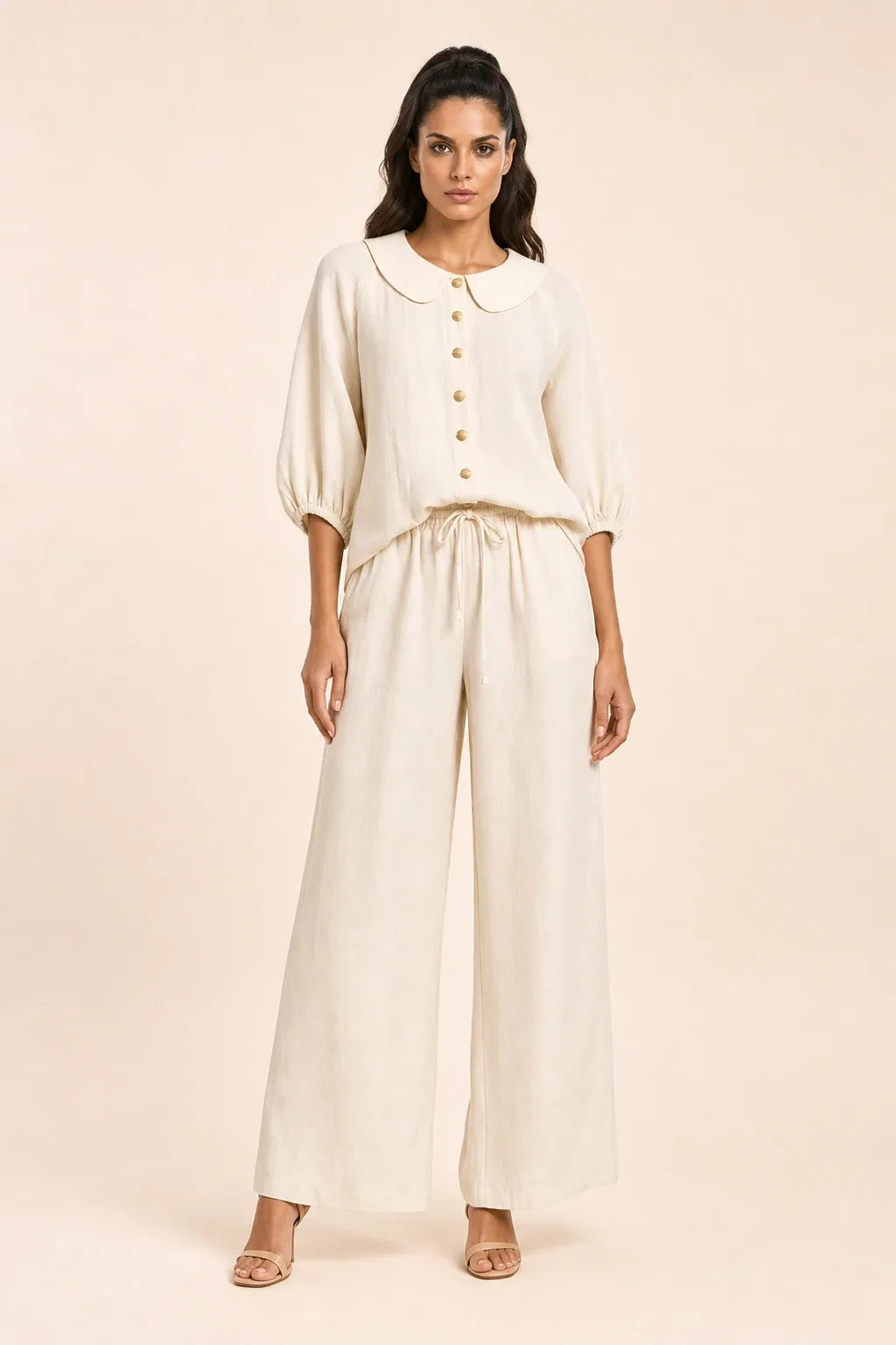 White peter pan collar top and matching shorts set on model in contrapposto stance