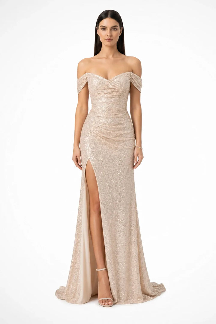 Champagne sequin ruched gown on a model in a contrapposto stance