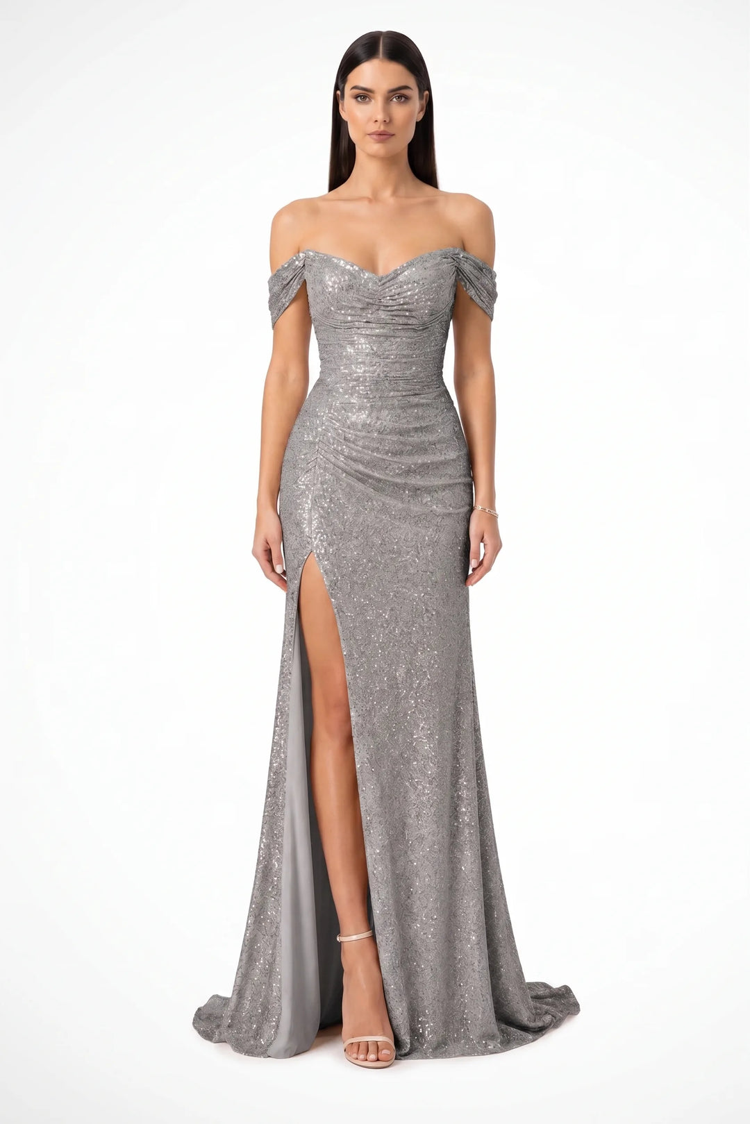 Grey sequin ruched gown on a model in a contrapposto stance