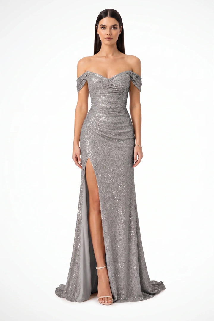 Grey sequin ruched gown on a model in a contrapposto stance