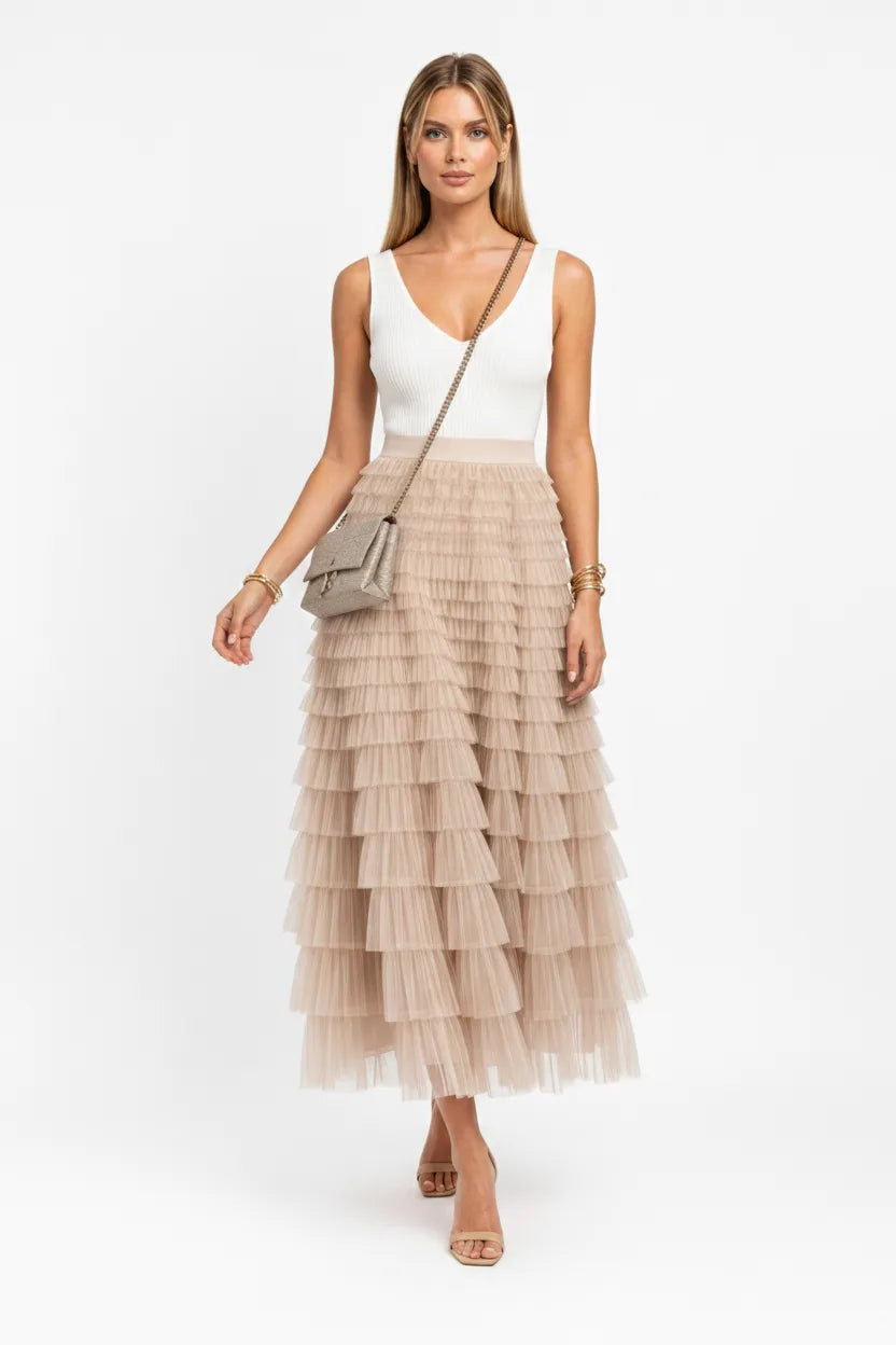 Beige tiered tulle maxi skirt on a model in natural movement