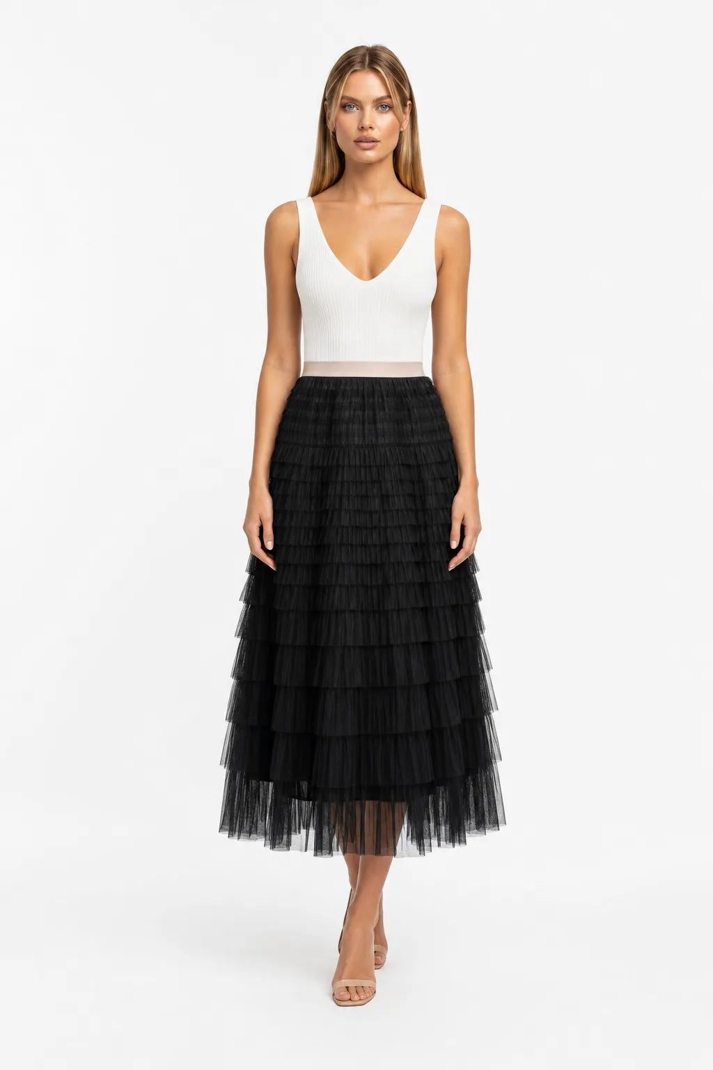 Black tiered tulle maxi skirt on a model in a contrapposto stance