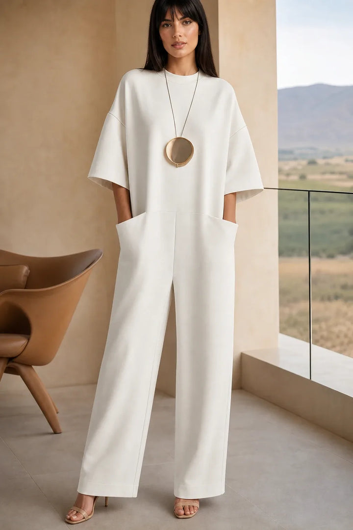 White wide-leg jumpsuit on model in contrapposto stance