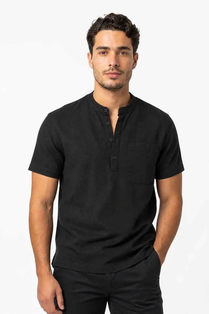 Black linen henley popover shirt on male model in contrapposto stance
