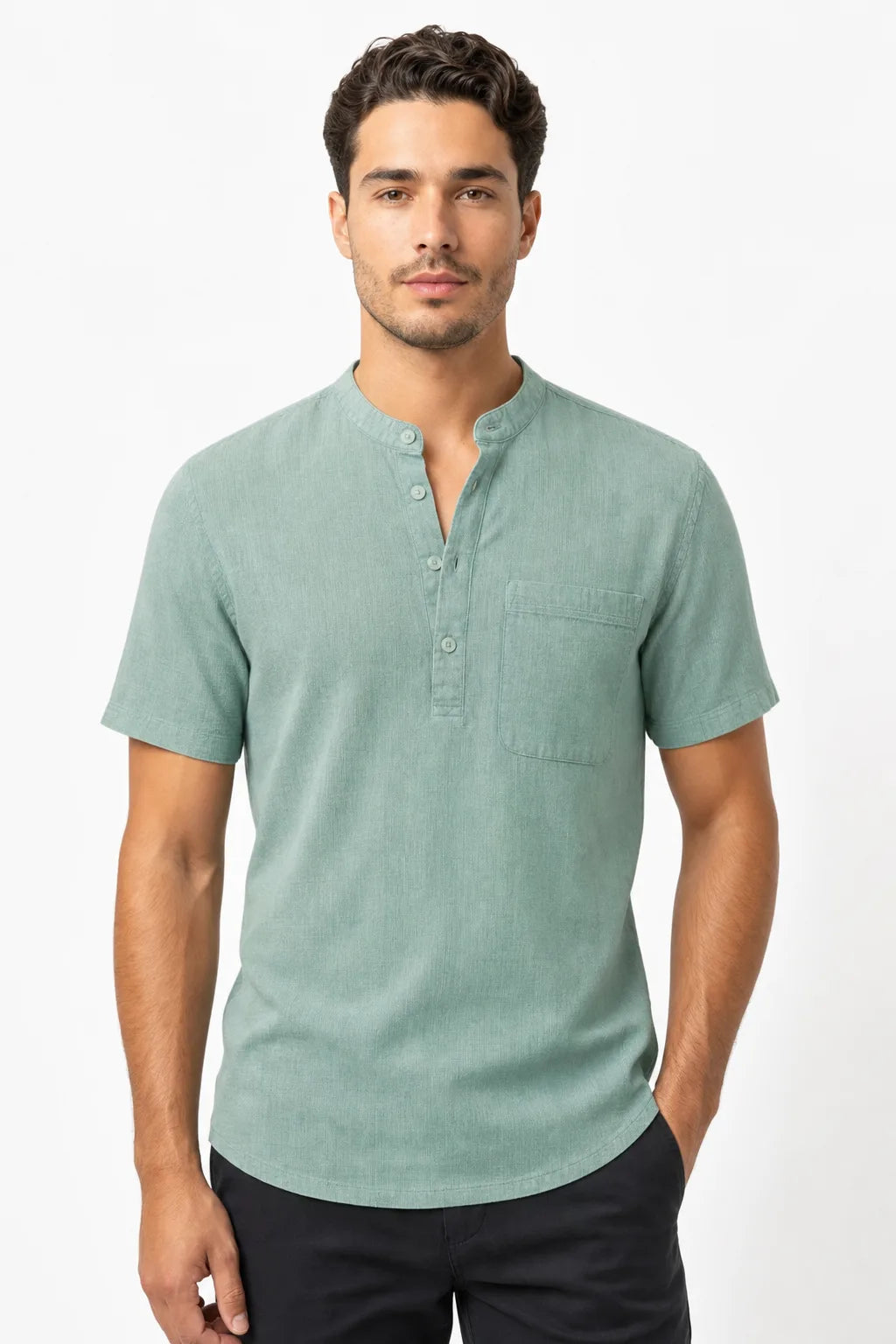 Green linen henley popover shirt on male model in contrapposto stance