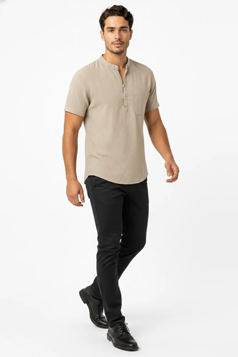 Khaki linen henley popover shirt on male model in natural movement pose