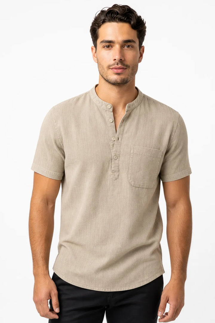 Khaki linen henley popover shirt on male model in contrapposto stance