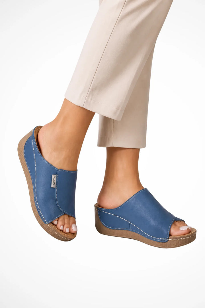 Blue wedge slip-on mule shown from the front