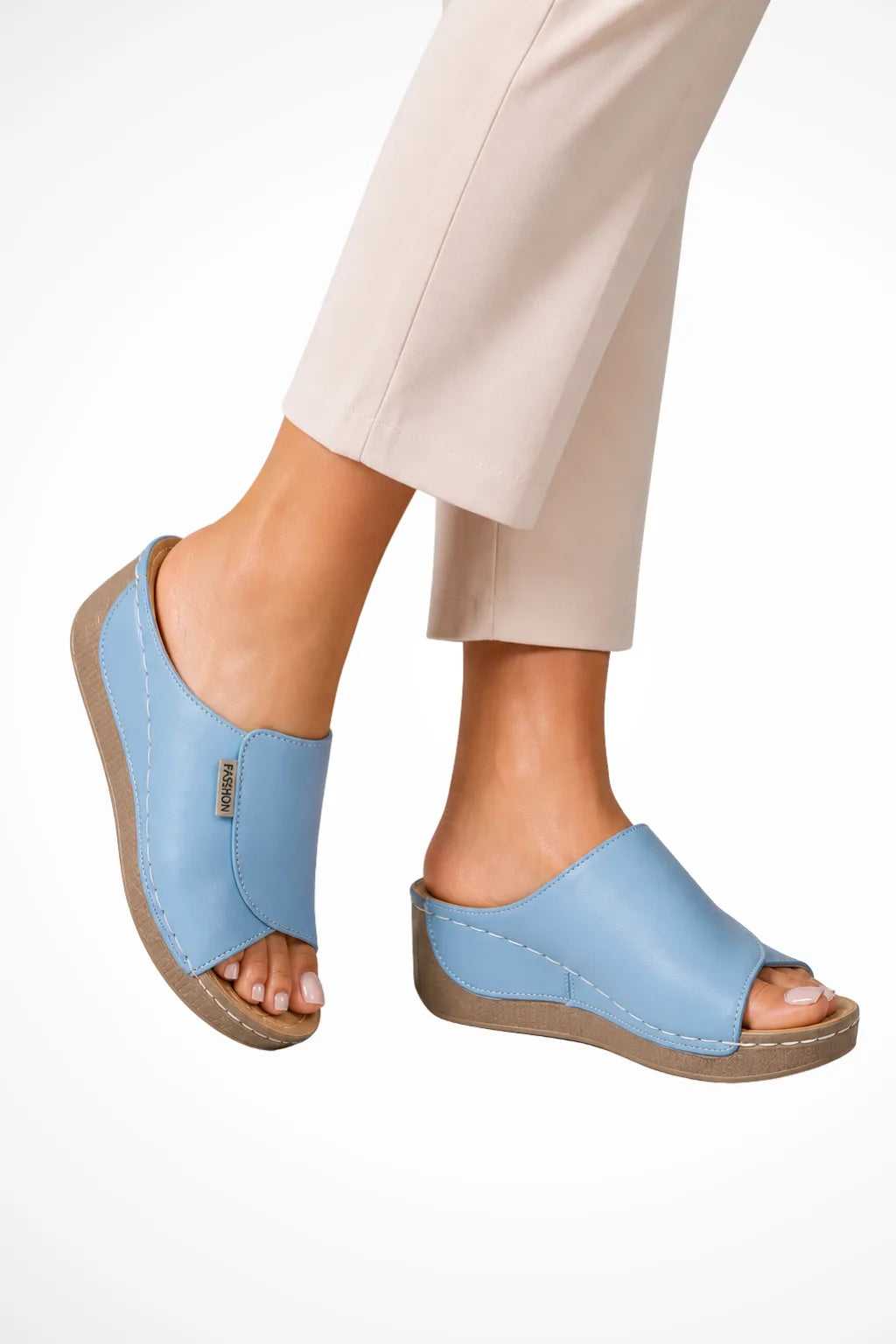 Light blue wedge slip-on mule shown from the front