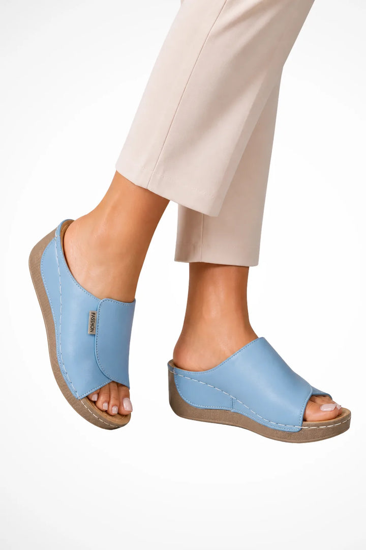 Light blue wedge slip-on mule shown from the front