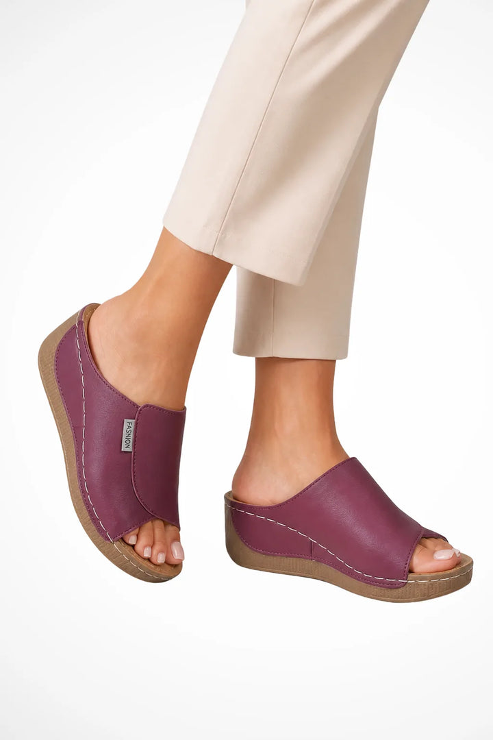 Purple wedge slip-on mule shown from the front