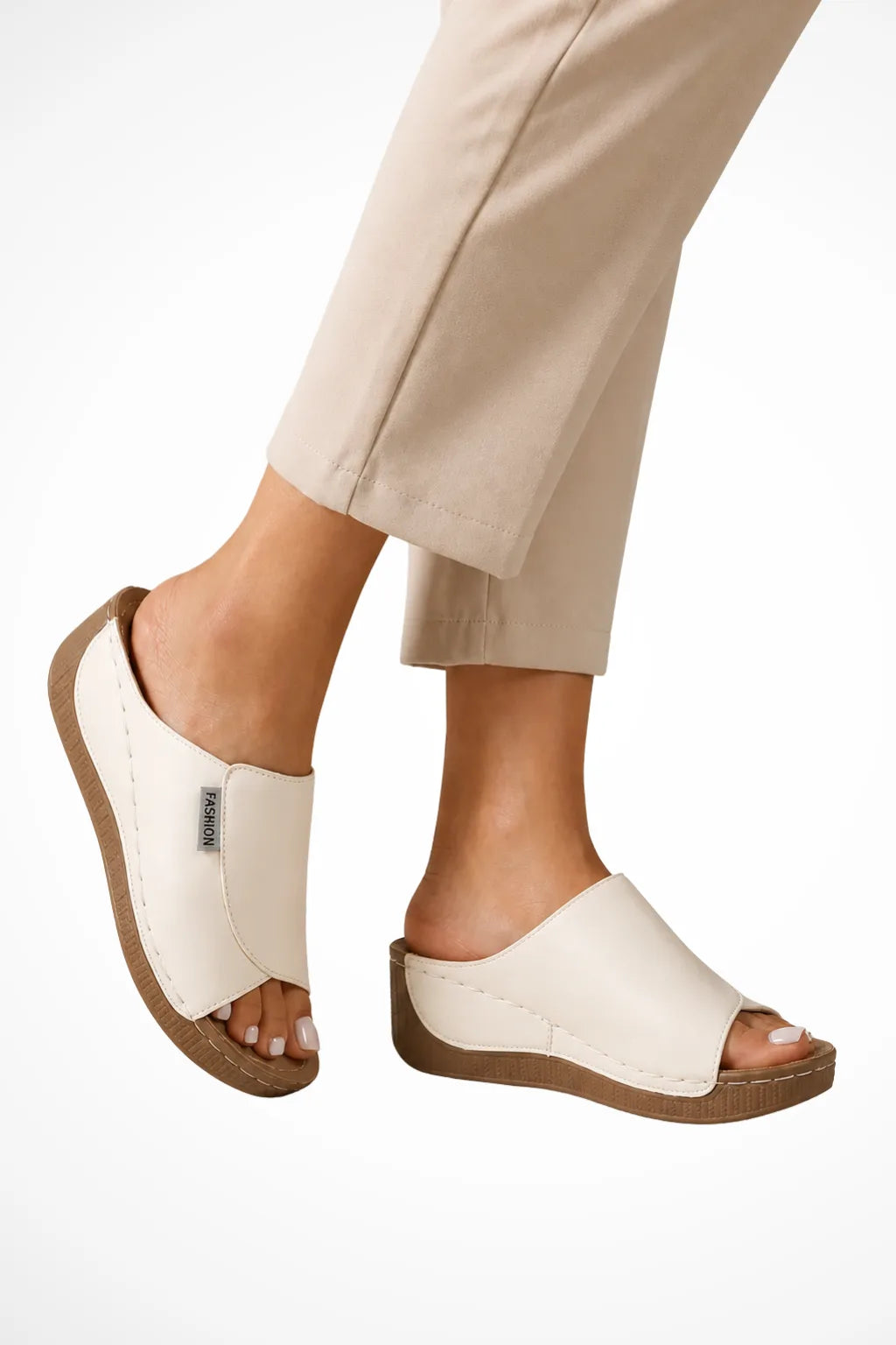 White wedge slip-on mule shown from the front