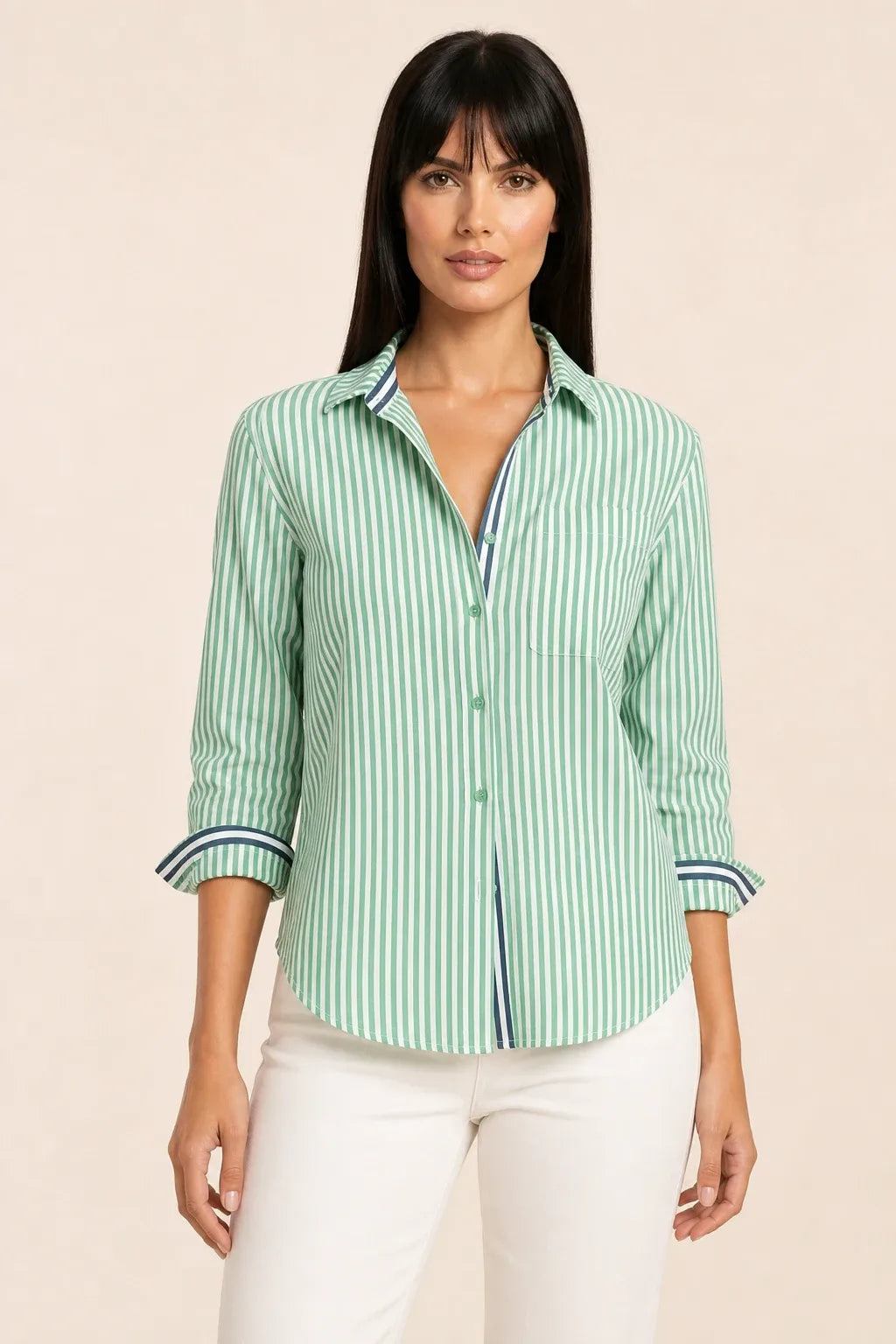 Oversized green striped shirt on model in relaxed contrapposto stance