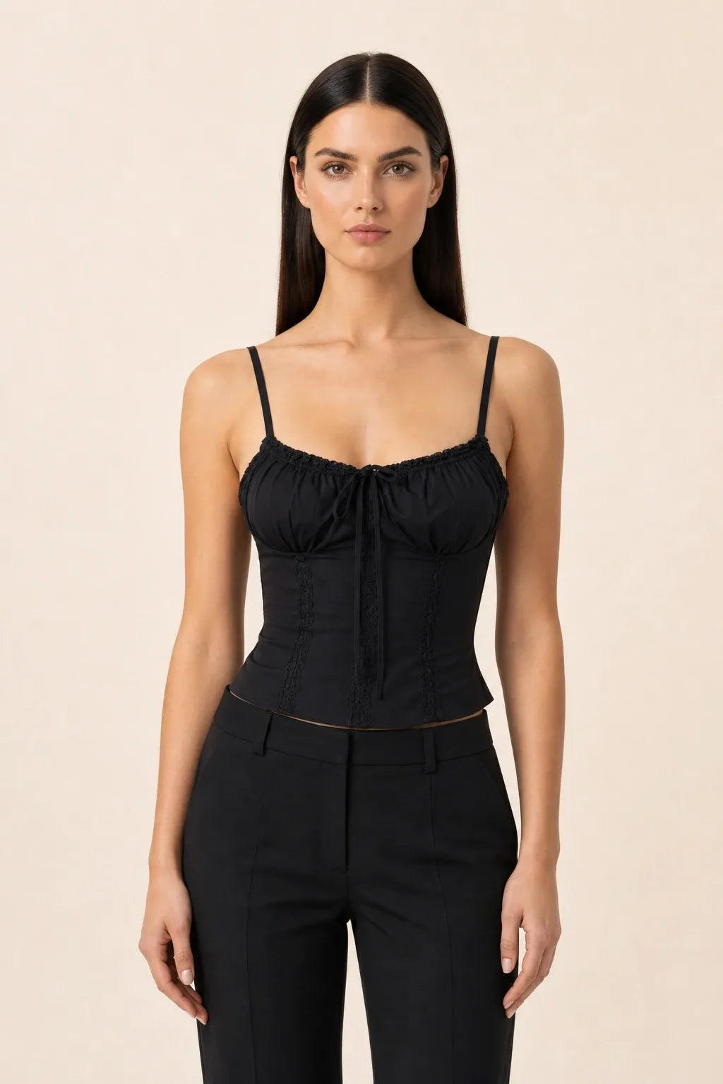 Black lace trim corset cami on a model in a contrapposto stance