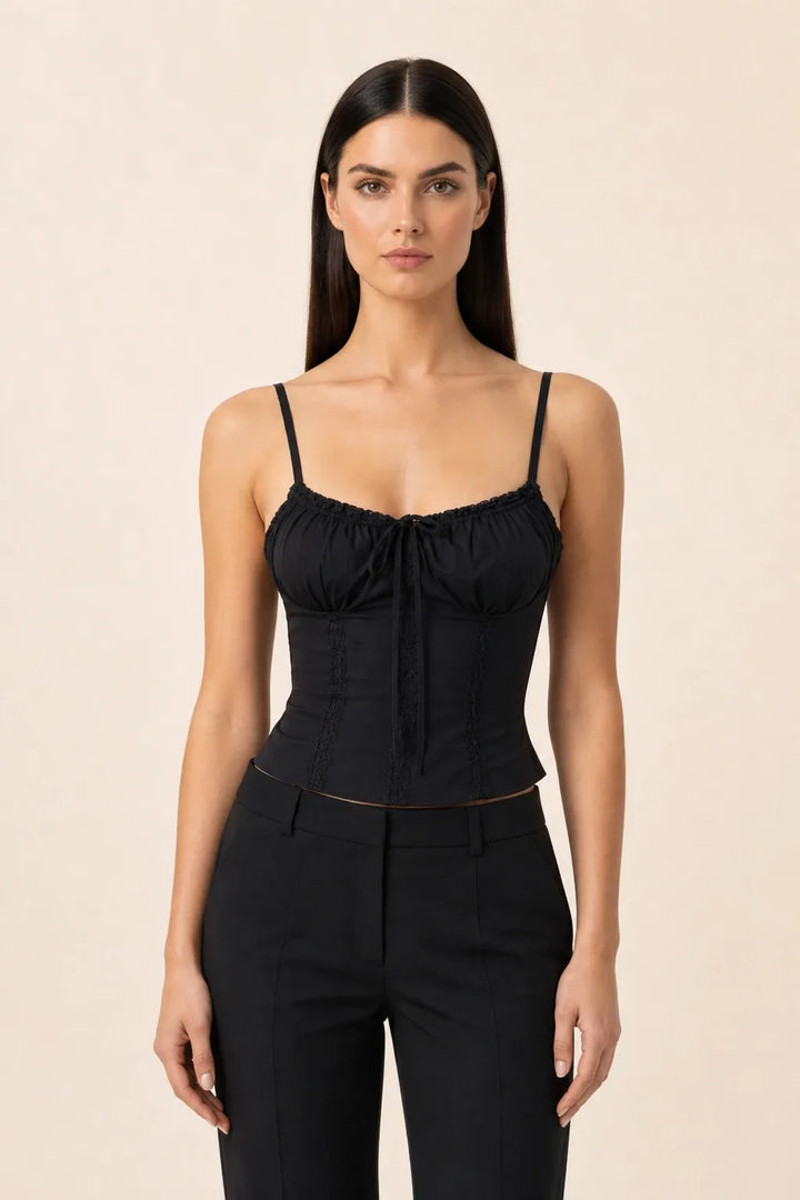 Black lace trim corset cami on a model in a contrapposto stance