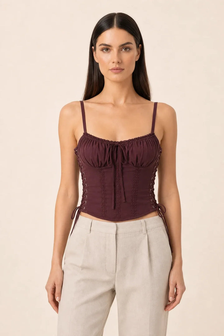Chocolate brown lace trim corset cami on a model in a contrapposto stance